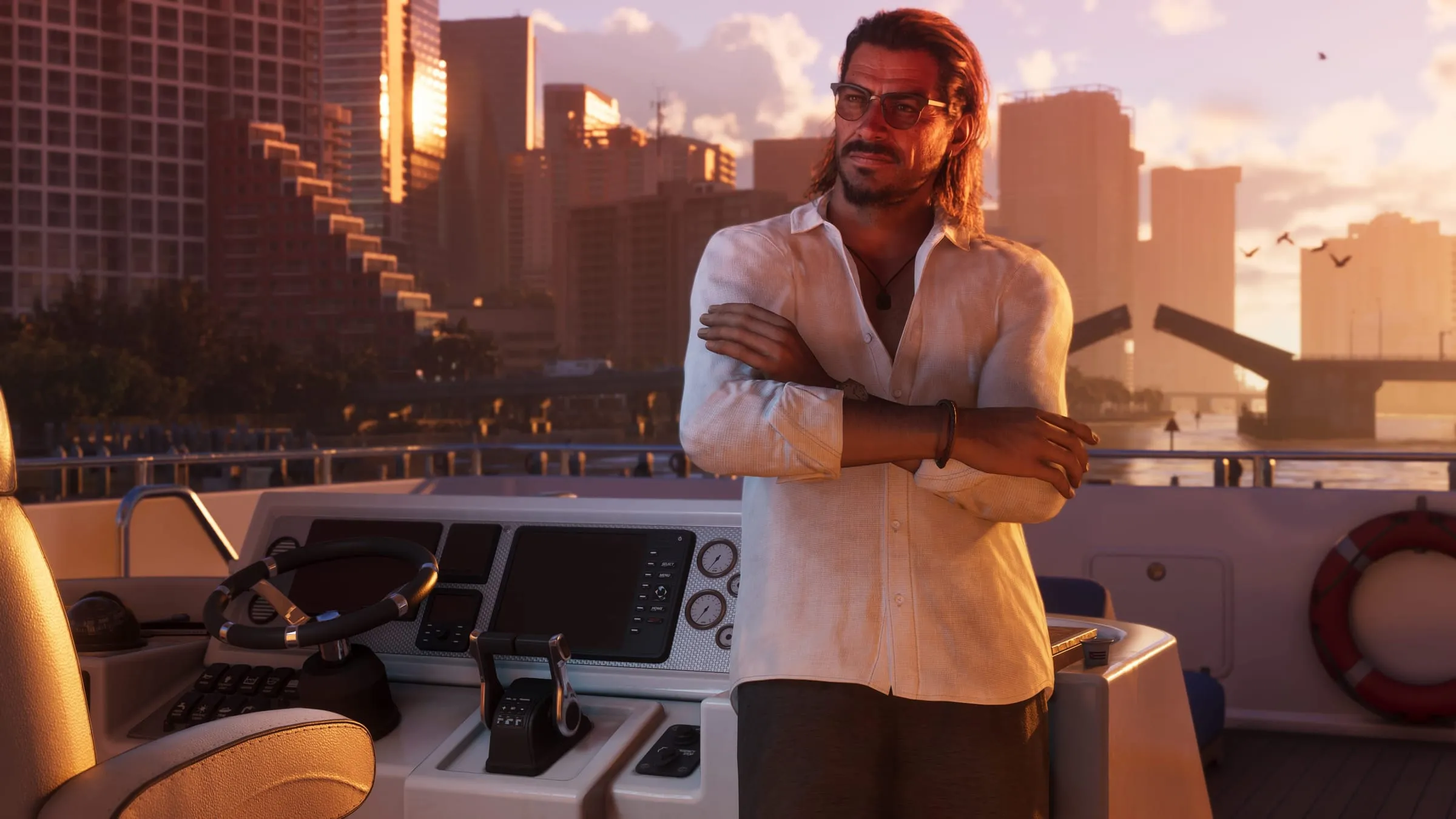 Raul Bautista on the deck of a yacht, the skyline behind him