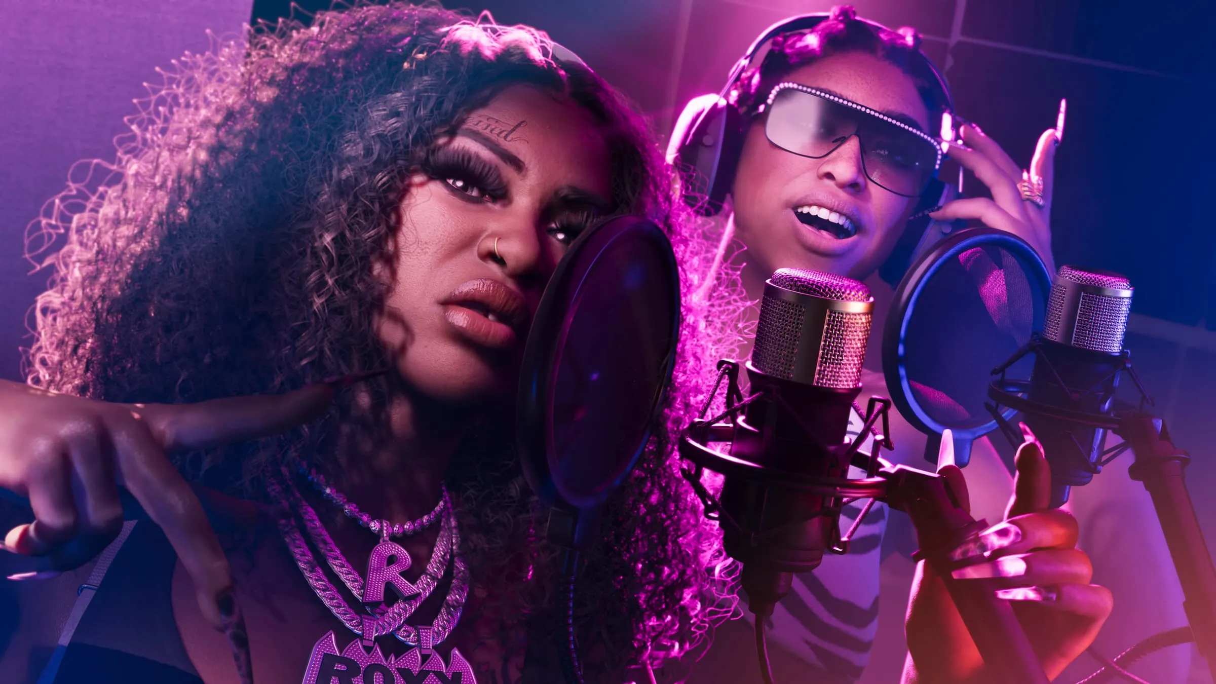 The Real Dimez recording at two microphones, under pink light