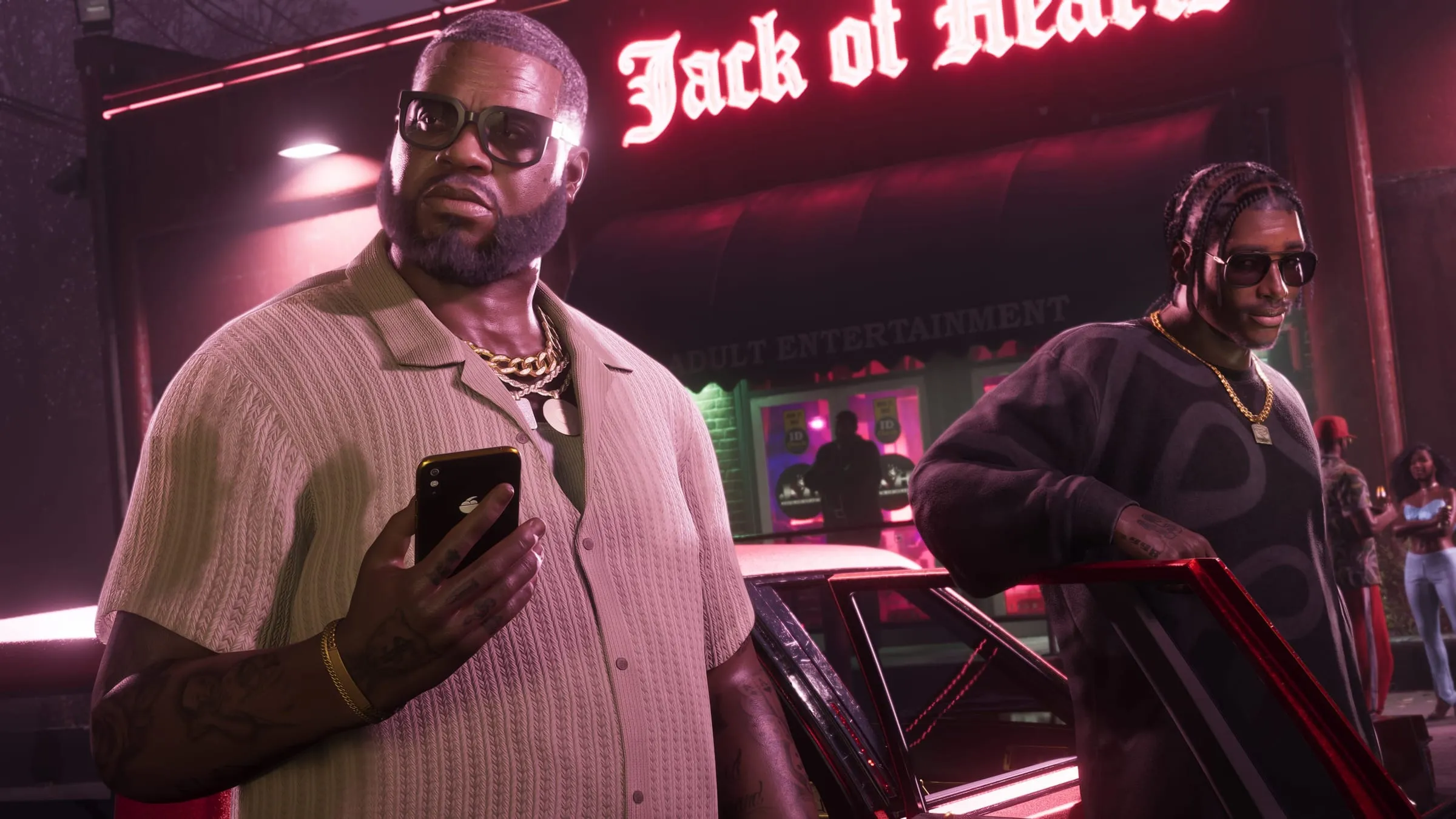 Boobie Ike in front of the Jack of Hearts neon sign