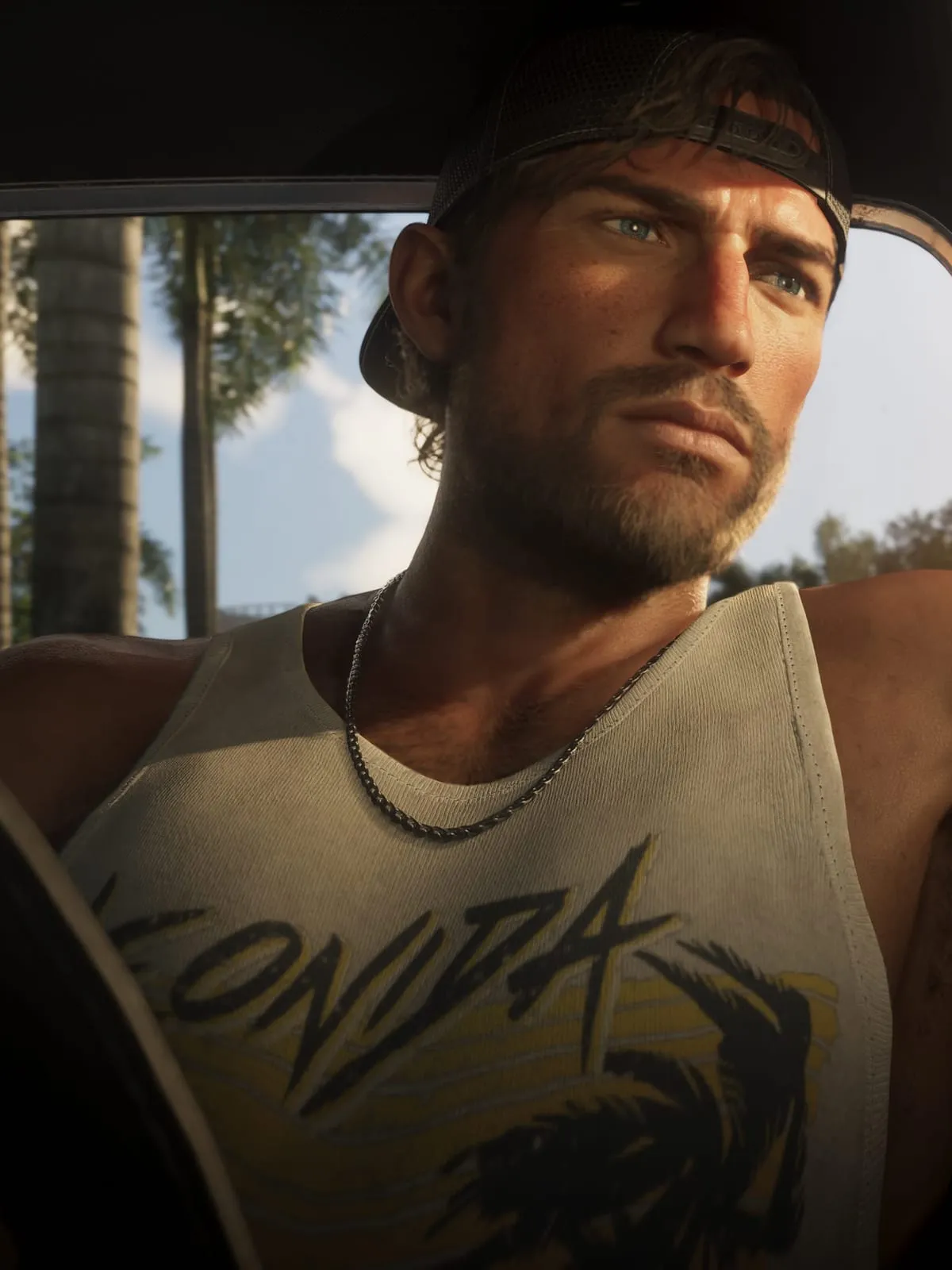Jason at the wheel of a car, at dusk
